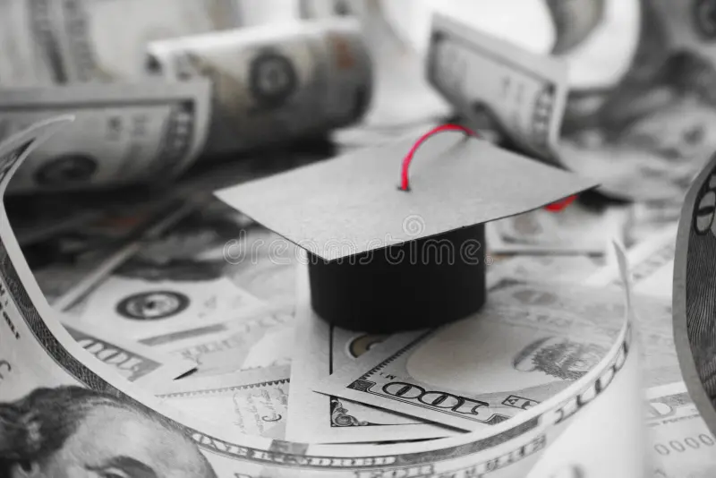 a graduating hat on a pile of money - often money is the major issue with self funding education. think strategically