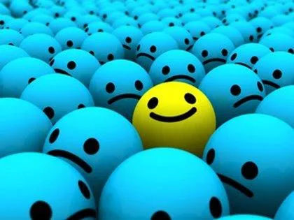 A yellow smiley ball in the sea of unhappy balls showcasing creativity & uniqueness is needed to get into a great university
