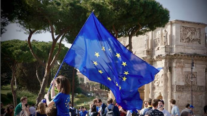 People marching with EU Flag
